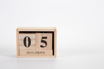 Wooden calendar October 05 on a white background
