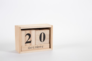 Wooden calendar October 20 on a white background