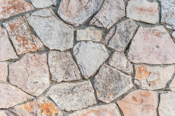 Fototapeta premium abstract background of pink and gray stone wall close up