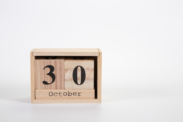 Wooden calendar October 30 on a white background