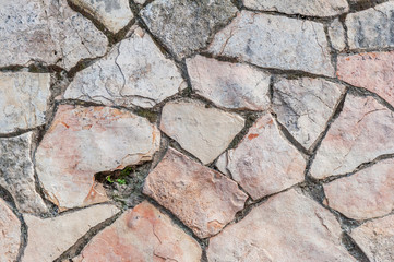 abstract background of pink and gray stone wall close up