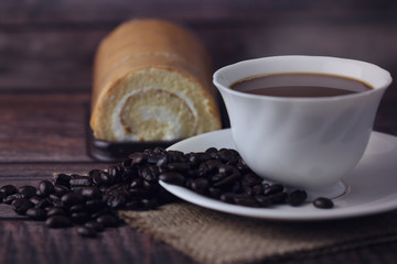 Hot coffee cup ,roll cake, breakfast