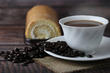 Hot coffee cup ,roll cake, breakfast