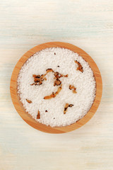 A bowl of sea salt infused with truffle shavings, shot from above with a place for text