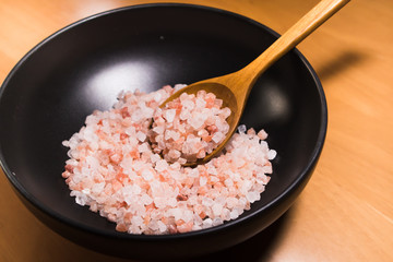 Pink salt from Bolivian in a black bowl