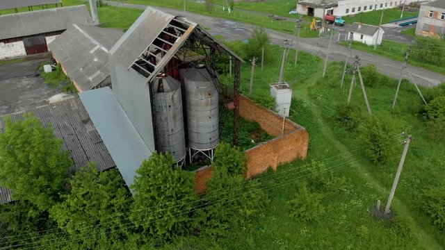 thrown hangars, with an old metal tower water reservoirs aerial background nature wallpapper