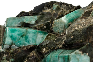 Macro emerald stone mineral in rock on white background © Minakryn Ruslan 