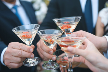 people clinking glasses of champagne