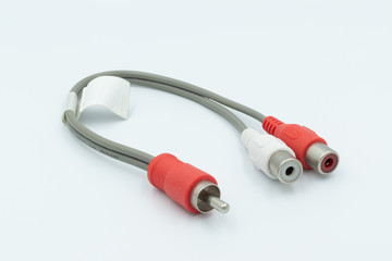 This is a capture for a red and white RCA cable on a white background and a studio light