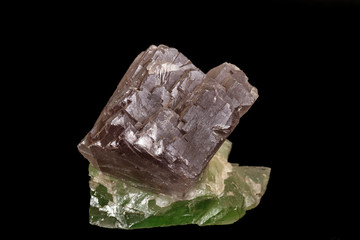 macro mineral fluorite stone on black background
