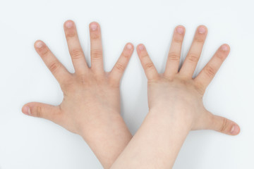 This is a capture for a child hand on a white background in a studio light 