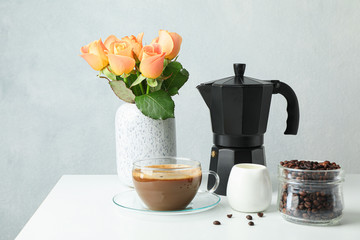 Coffee time accessories on white table against light background, space for text. Fresh coffee