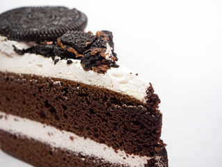 Chocolate cake slice with curl on white background