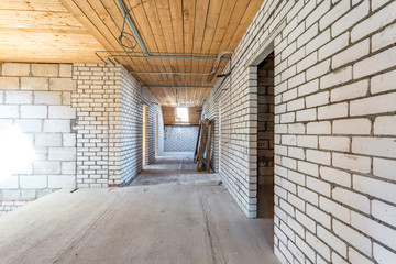 empty interior in house without repair with white silicate brick walls