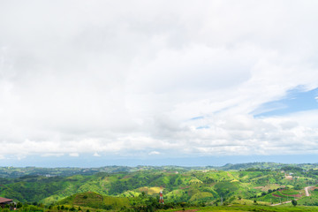 Obraz premium Blue sky high peak mountains fog hills mist scenery national park views at Phu Tub Berk, Khao Koh, Phetchabun Province, Thailand
