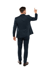 back view of businessman pointing with finger while standing isolated on white