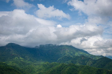 Obraz na płótnie Canvas Blue sky high peak mountains fog hills mist scenery national park views at Phu Tub Berk, Khao Koh, Phetchabun Province, Thailand