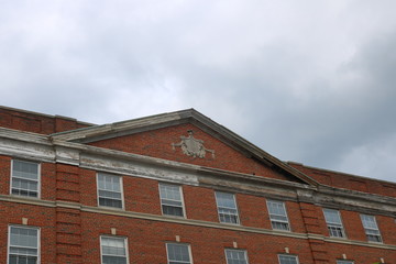 Fototapeta na wymiar Rooftop of historic b brick ornate architecture building