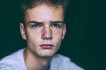 Fototapeta premium Handsome young man teenager , isolated, black background