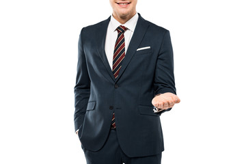 Obraz na płótnie Canvas cropped view of cheerful man in suit smiling and gesturing isolated on white