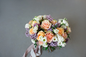 Close-up bouquet of flowers on the round white table indoors