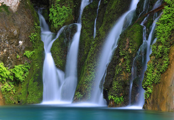 waterfall on green stones