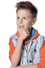 Portrait of handsome little boy posing against white background