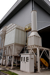 Air pollution control equipment as dust filter collection and chimney stack locates  out of...