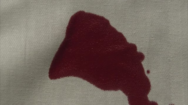 soaked bandage in red