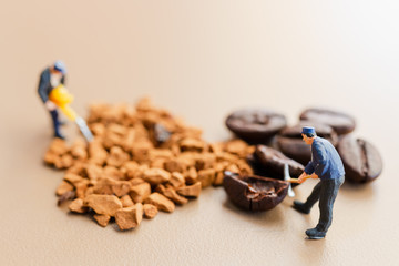 Miniature people : Teams work extremely well together on coffee blend process 