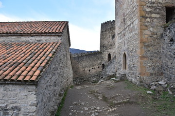 Fototapeta na wymiar Walls of Ananuri Fortress with Gothic Arch Doorways, Georgia