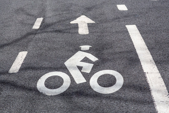 Bike lane road markings on a pavement
