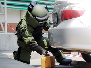 Bomb Disposal Expert in Bomb suit for Explosive ordnance disposal