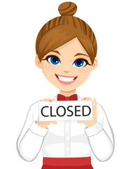 Smiling young barista waitress girl holding closed sign board isolated on white background