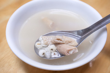 Four tonics soup, four ingredients herb flavor soup. Taiwanese delicious street food delicacy with Job's tears, pork intestines, close up, copy space