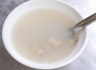 Four tonics soup, four ingredients herb flavor soup. Taiwanese delicious street food delicacy with Job's tears, pork intestines, close up, copy space