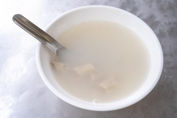 Four tonics soup, four ingredients herb flavor soup. Taiwanese delicious street food delicacy with Job's tears, pork intestines, close up, copy space