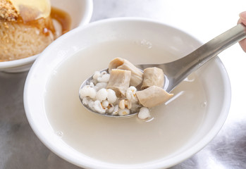 Four tonics soup, four ingredients herb flavor soup. Taiwanese delicious street food delicacy with Job's tears, pork intestines, close up, copy space
