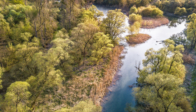 Landscape on top. The flow of the river against the backdrop of a forest in the countryside in France photographed by a DJI drone.