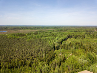 Fototapeta na wymiar aerial view of countryside fields and forests in green summer day
