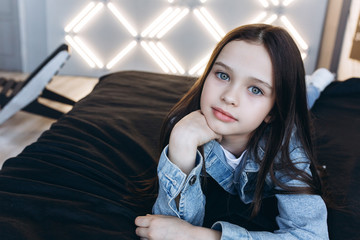 Obraz premium Close up portrait of young pretty young cute brunette girl professional model posing in studio. Cover girl, modeling, beauty, fashion concept