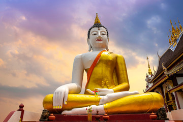 Beautiful big buddha image on colorful sky background at rajamontean temple in Chiang Mai ,Thailand...