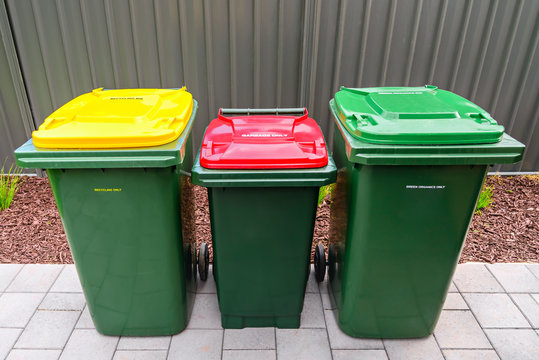 Australian home wheelie bins set on backyard