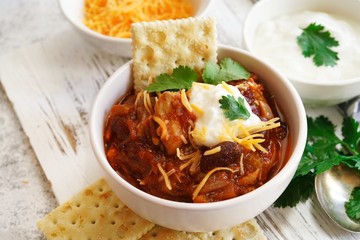 Homemade Chili bowl served with crackers, selective focus
