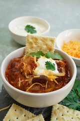 Homemade Chili bowl served with crackers, selective focus