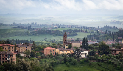 Fototapeta premium Cloudy Tuscany landscape from Siena