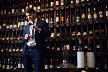 elegant young tasting different wines. selection of degustation. sensory examination and evaluation of wine. copy space