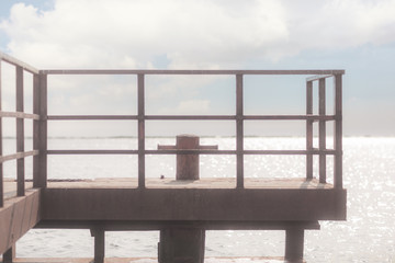 Iron pier on the river in the afternoon