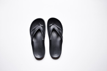 Flip Flops on a white isolated background. Men's black flip flops.