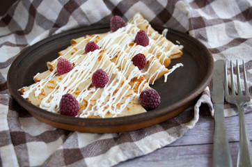 Pancakes with sour cream and raspberry. Delicious home breakfast. 